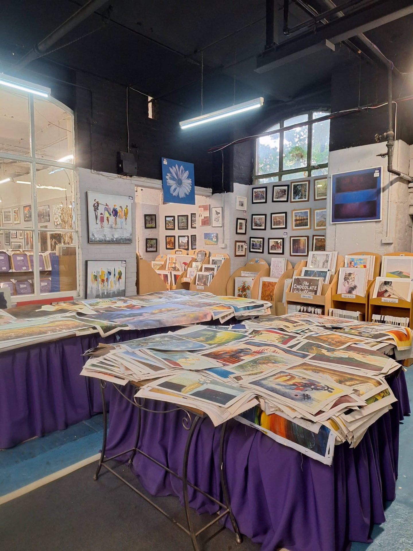 The studio counter with framed artwork and mount samples