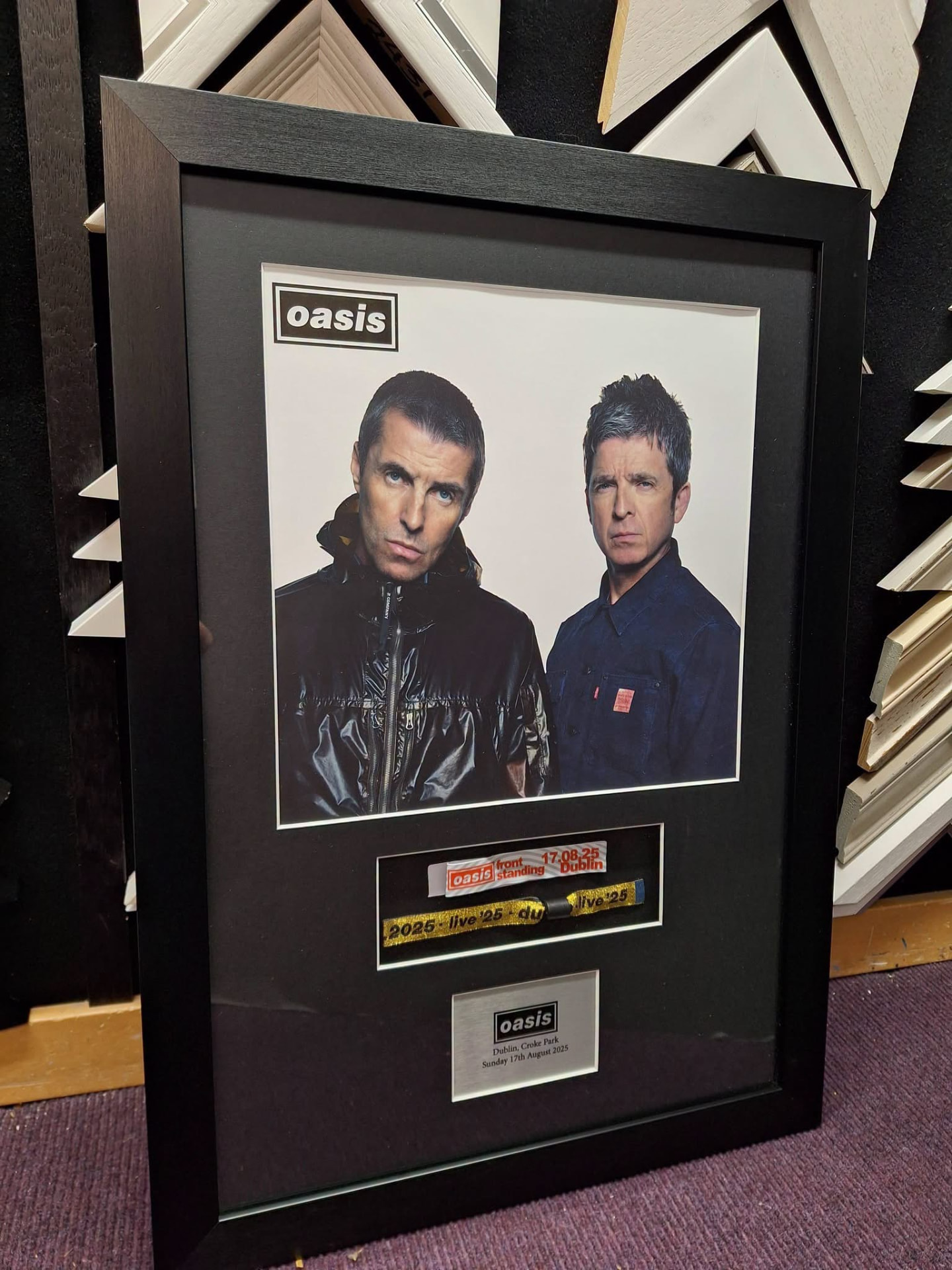 Concert photo and wristband framed together