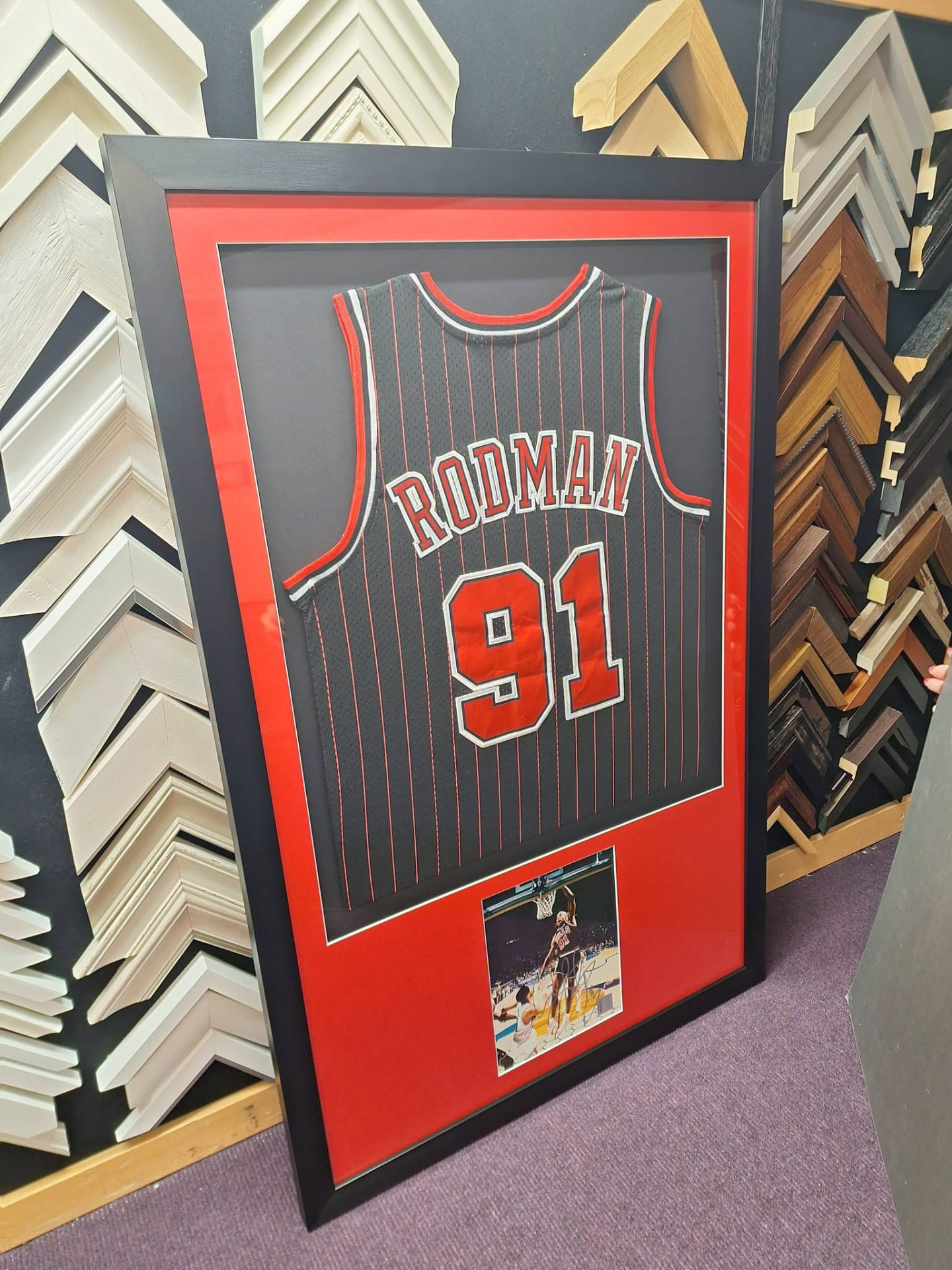Rodman 91 basketball jersey framed with an action photograph