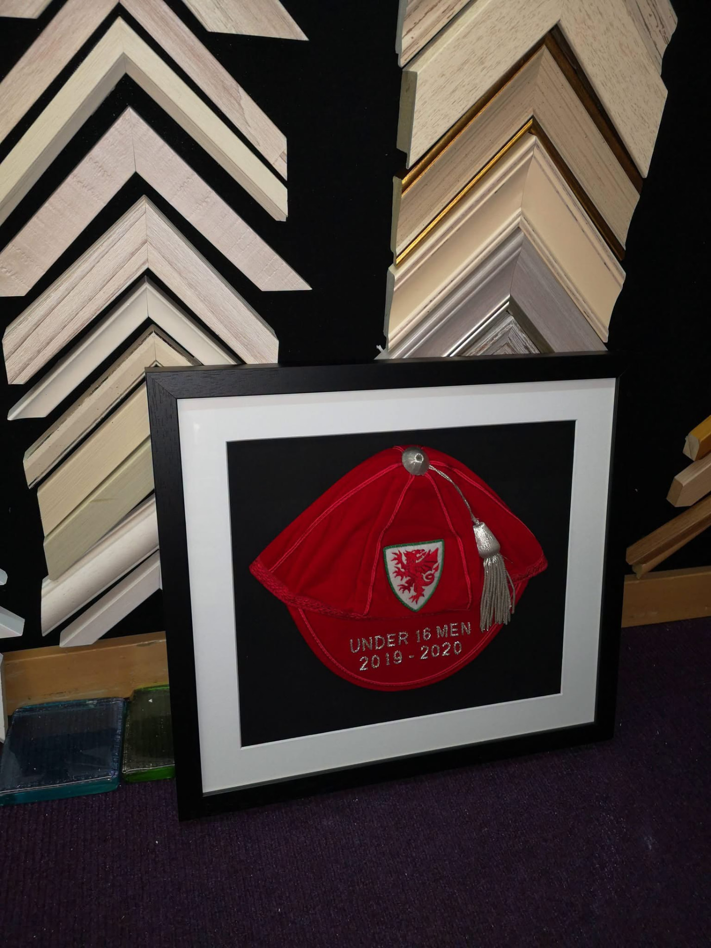 International cap in a black frame